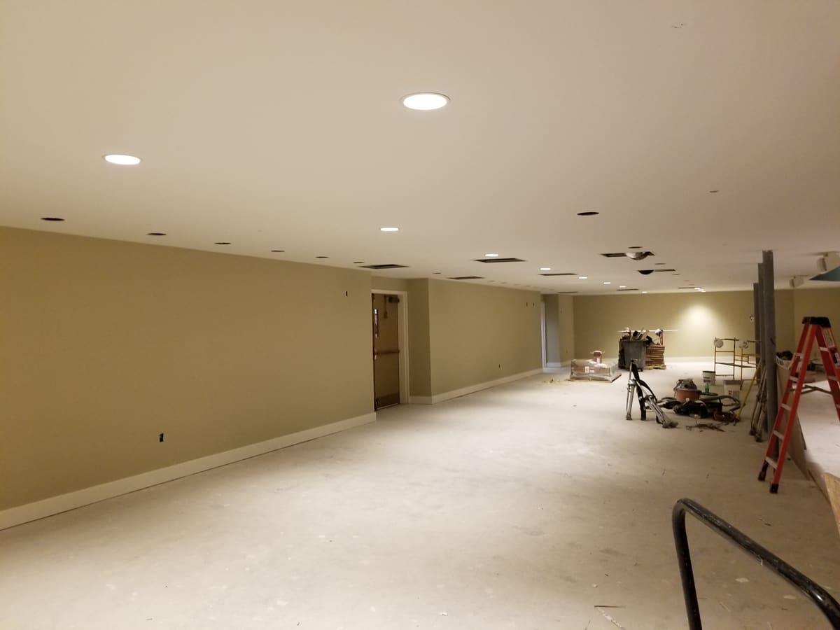 Large finished commercial room with recessed lighting